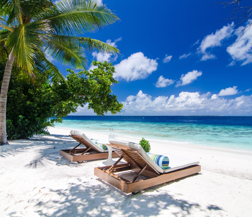 The cushioned beachside day beds right outside our Maldives Beach Villa with pool.
