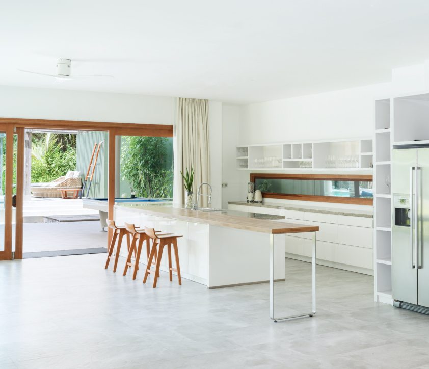 The large fully equipped kitchen with a large island in the Great Beach Residence Maldives.