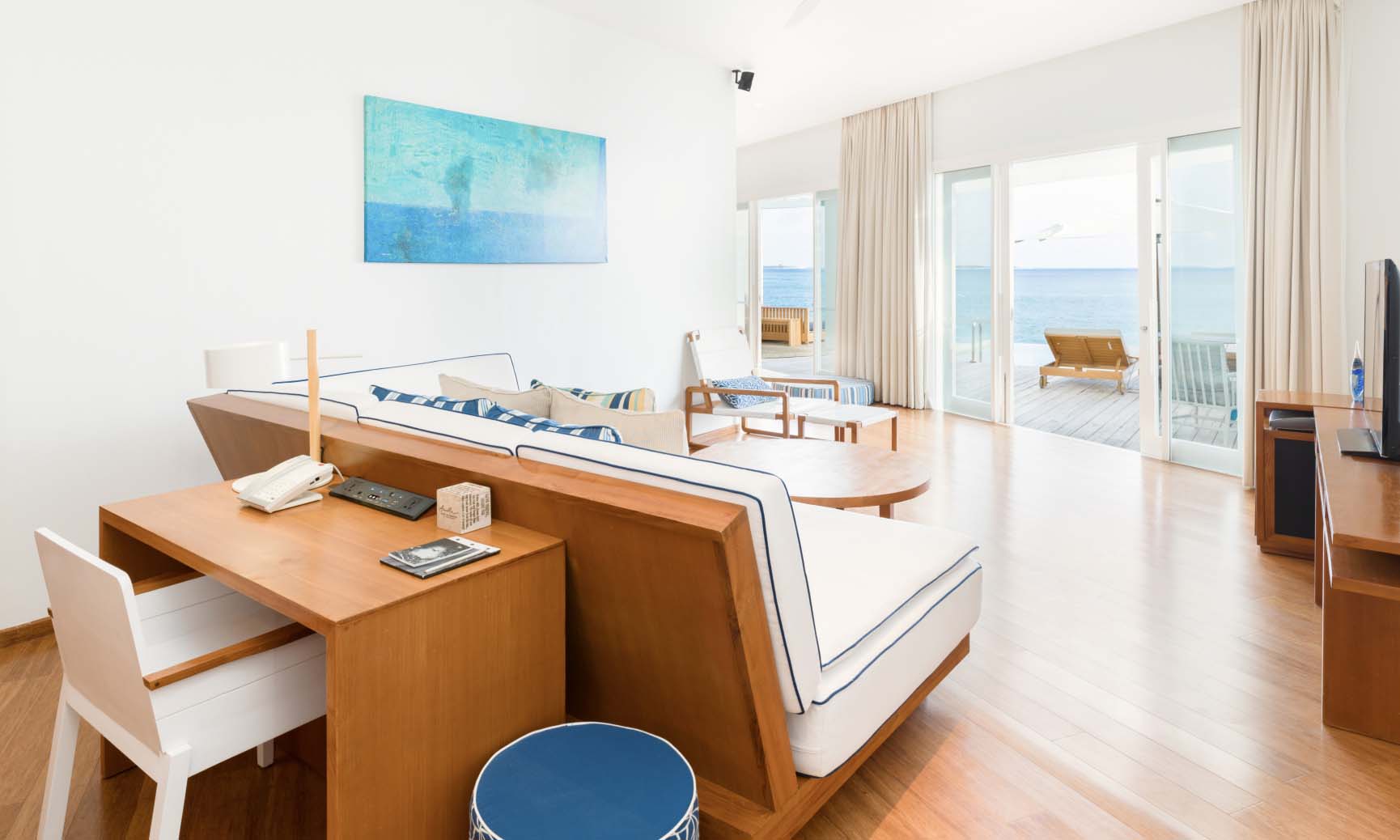 The living room inside of our 1 Bedroom Maldives Lagoon Pool Villa.