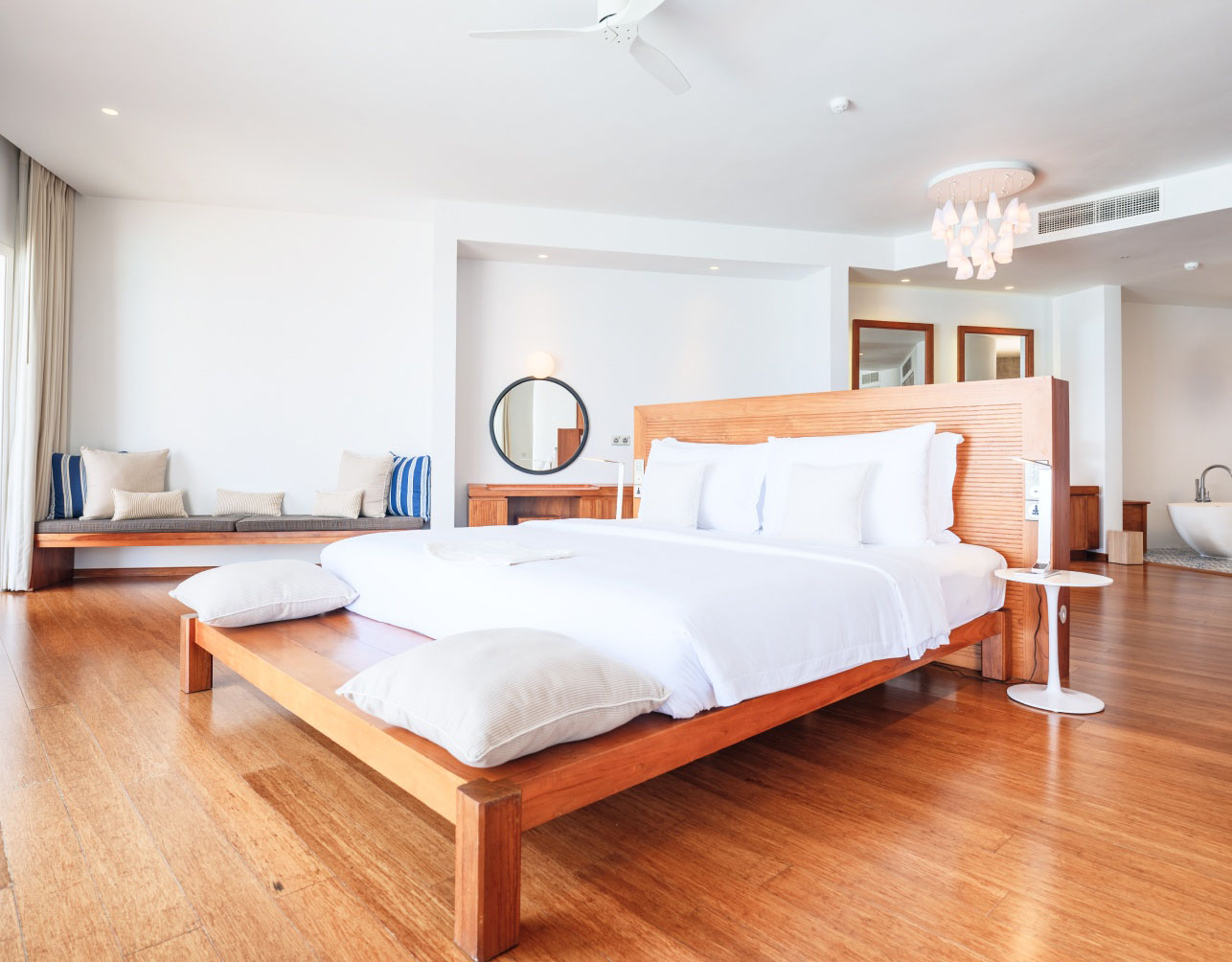 The bedroom with 1 king bed inside of our Maldives Reef Water Villa.